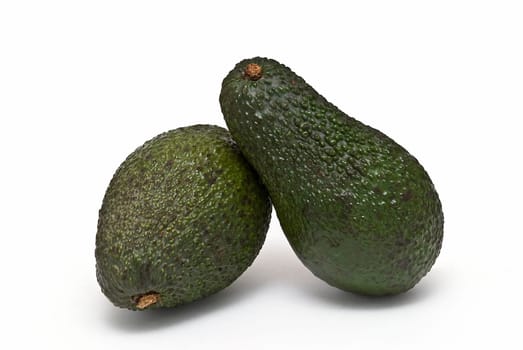 Fresh avocados isolated on a white background.