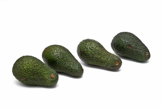 Fresh avocados isolated on a white background.