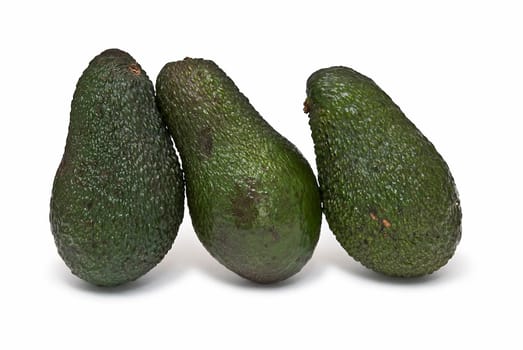 Fresh avocados isolated on a white background.