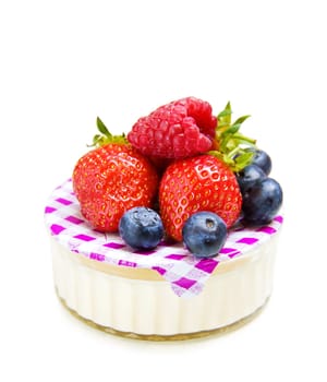Delicious strawberry, raspberry and blueberry dessert with yogurt. Isolated on white.