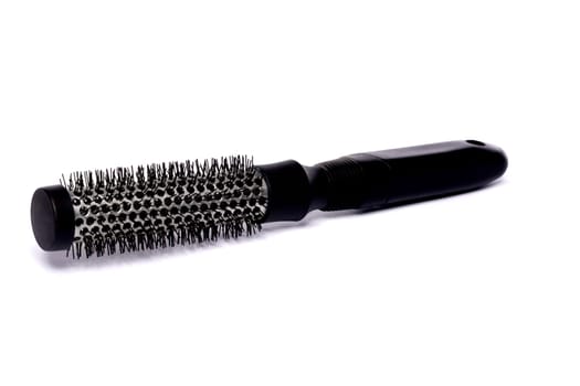 Close up view of a hair brush isolated on a white background.