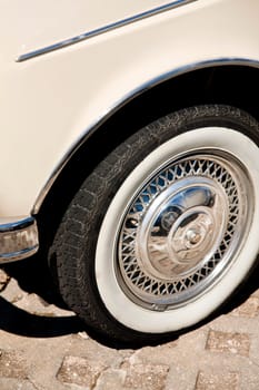 Close up view of the detail of a wheel from a car.
