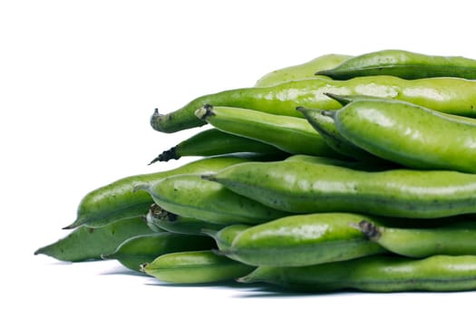 Close up view of some broad beans isolated on a white background.