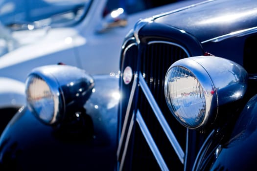Close view detail of the front of a classic French car.