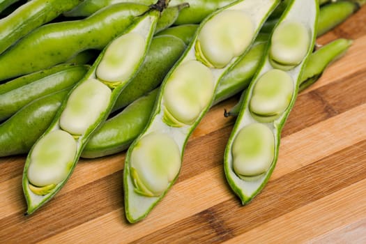 Close up view of some broad beans isolated on a white background.
