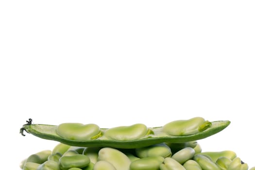 Close up view of some broad beans isolated on a white background.