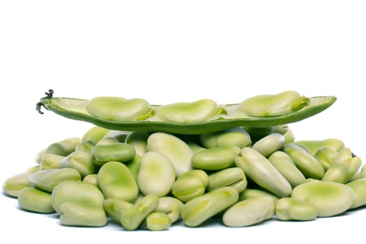 Close up view of some broad beans isolated on a white background.