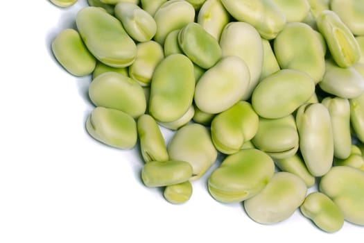 Close up view of some broad beans isolated on a white background.