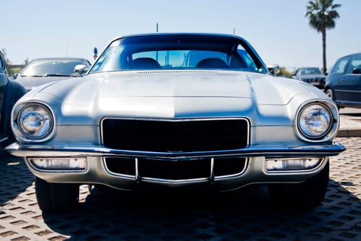 Close view of an American classic seventies car parked.