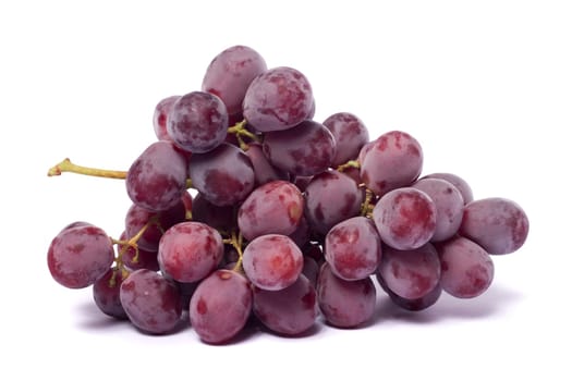Close up view of some red wine grapes isolated on a white background.