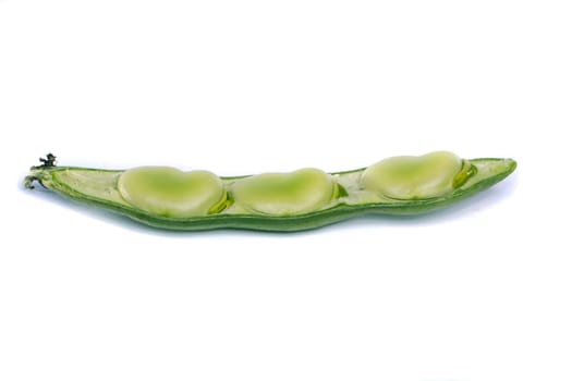 Close up view of some broad beans isolated on a white background.