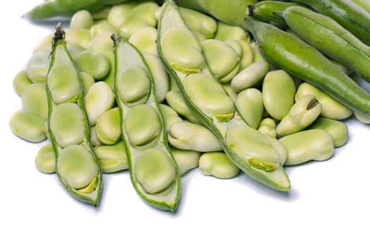 Close up view of some broad beans isolated on a white background.