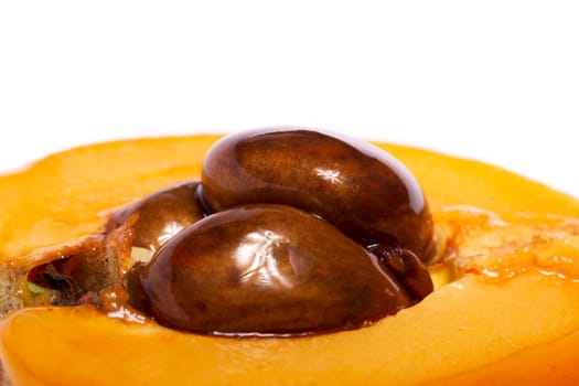 Close up view of some loquat fruit isolated on a white background.