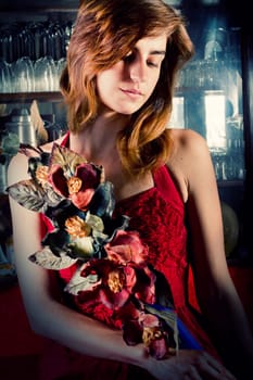 View of a beautiful young girl in a red dress on a living room.