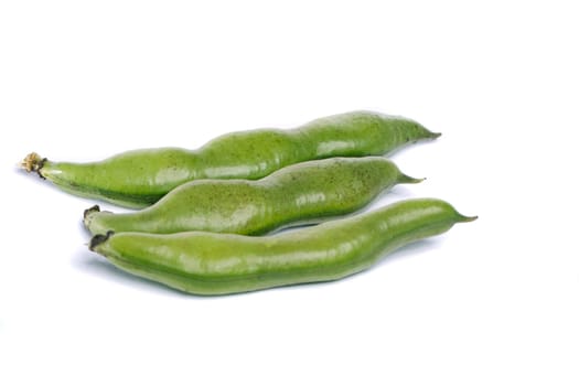 Close up view of some broad beans isolated on a white background.