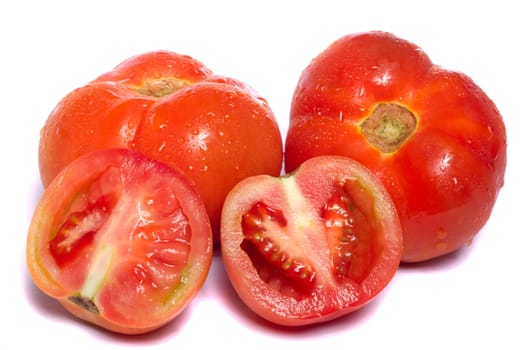 Close up view of a bunch of red tomatoes isolated on a white background.