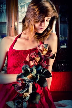 View of a beautiful young girl in a red dress on a living room.