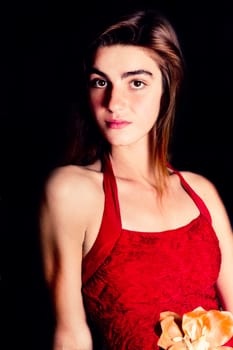 View of a beautiful young girl in a red dress on a living room.