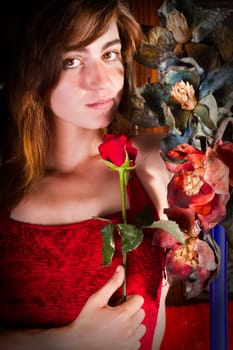 View of a beautiful young girl in a red dress on a living room.