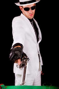 View of a white suit gangster man holding a gun.