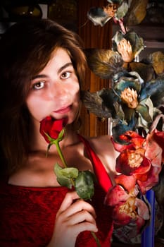 View of a beautiful young girl in a red dress on a living room.
