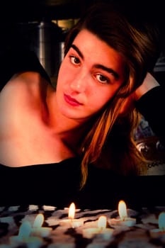 View of a beautiful young girl in a black dress on a living room.