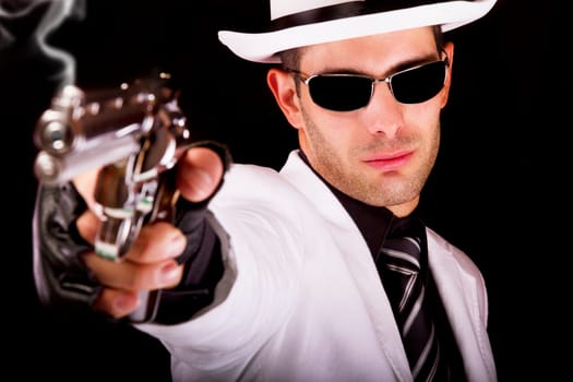 View of a white suit gangster man holding a gun.