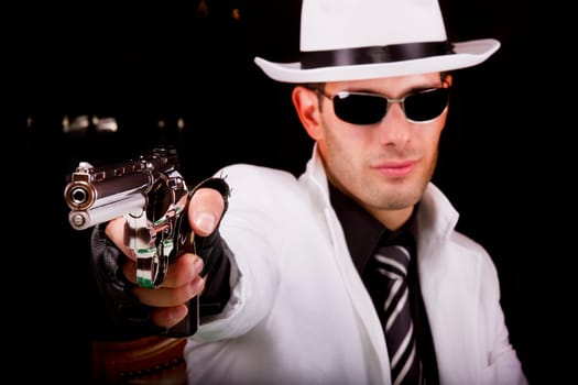 View of a white suit gangster man holding a gun.