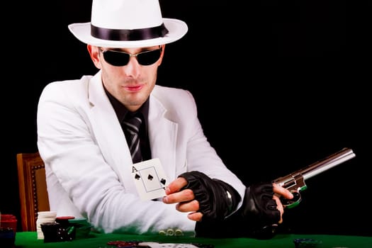 View of a white suit gangster man holding a gun.