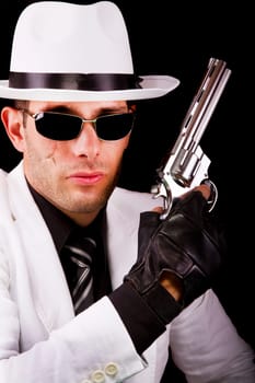 View of a white suit gangster man holding a gun.