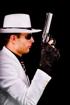 View of a white suit gangster man holding a gun.