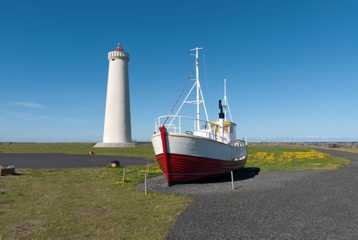 Lighthouse and boat on the Reykjanes peninsula in Reykjavik, Iceland