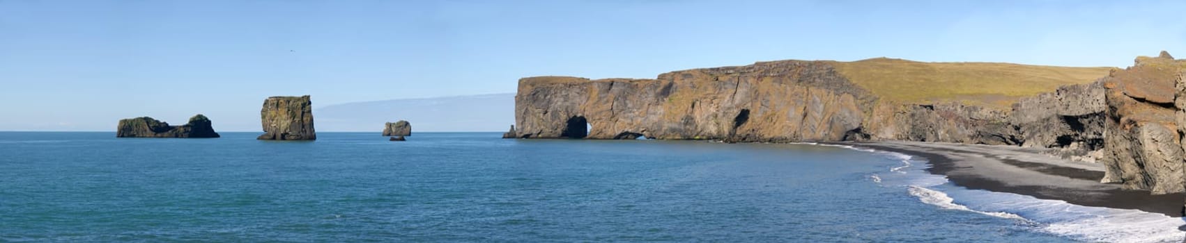 overview jagged cliffs on the coast of Vik