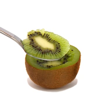 A kiwi half with a spoon