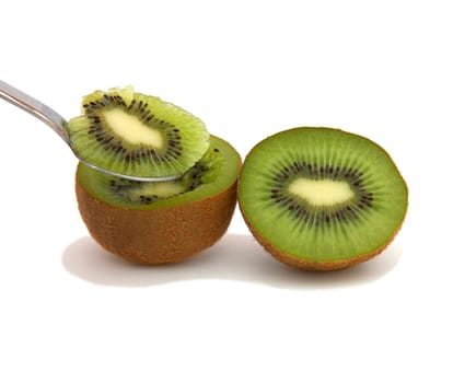 A kiwi half with a spoon
