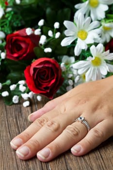 engagement ring and flower composition