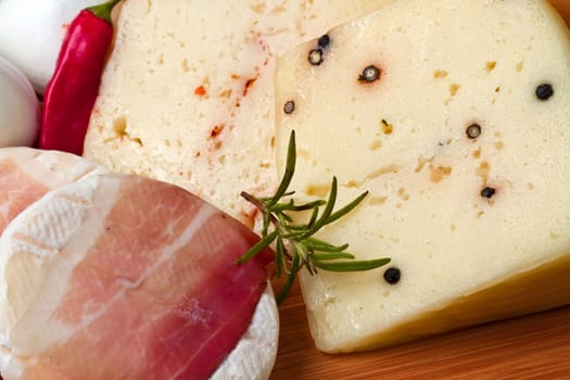 mixed cheese on wood table