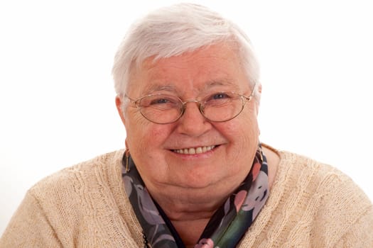 Gray-haired senior woman on light background