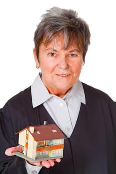 Female lawyer with model house isolated on white background