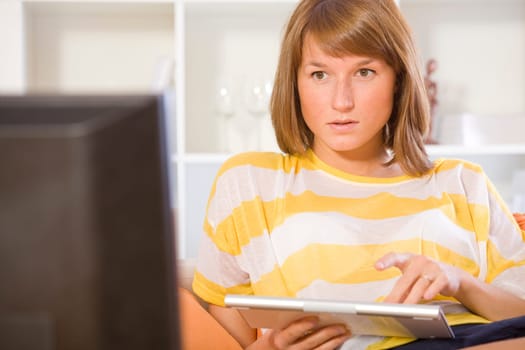 woman chatting on the sofa using keyboard
