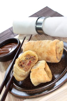 a spring roll filled with minced meat and tomatoes