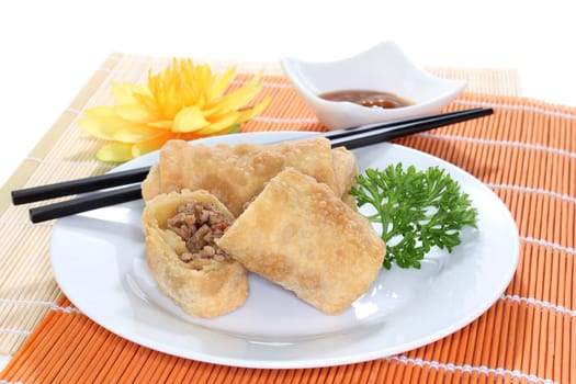 a spring roll filled with minced meat and tomatoes