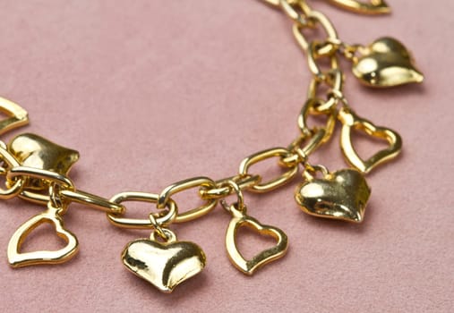 Nice golden bracelet in heart shape