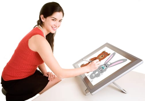 A young woman is drawing on a digital tablet.