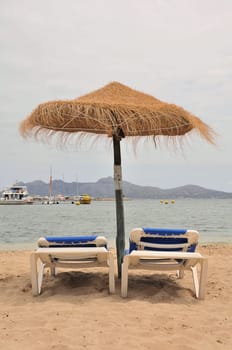 Parasol with sunbeds