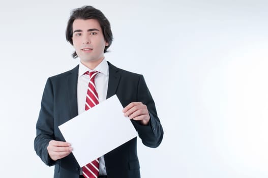 Businessman holding an empty advert in his hands