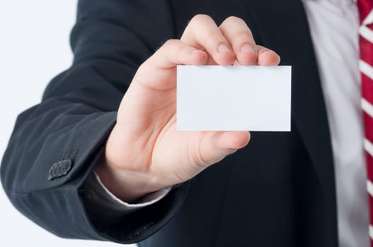 Young man holding an empty business card in his hand