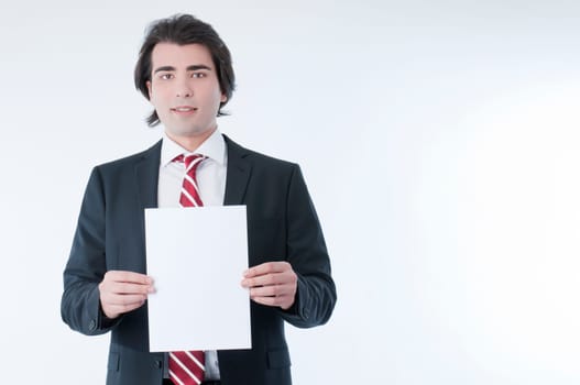 Businessman holding an empty advert in his hands