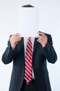 Businessman holding an empty advert in front of his face