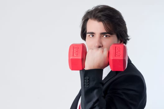 Businessman training with a weightlifting